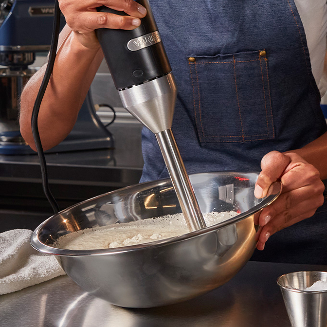 Immersion blender at work in bowl | Waring