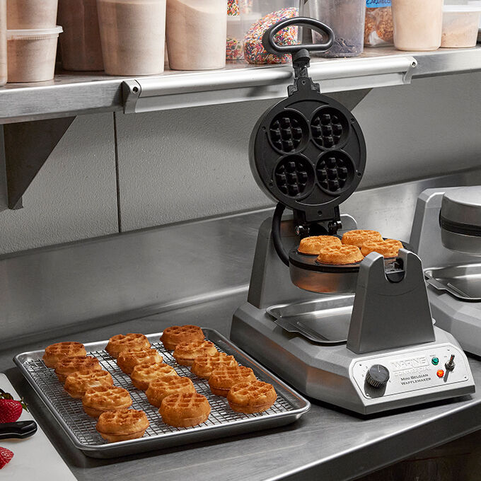 mini belgian waffle being cooked on a waffle maker